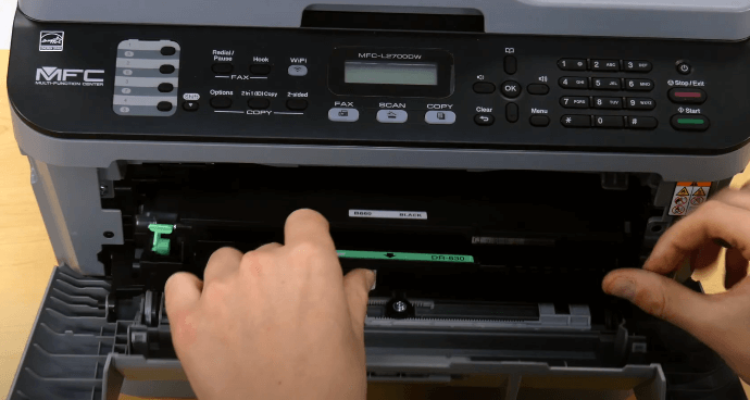 toner cartridge into printer slot