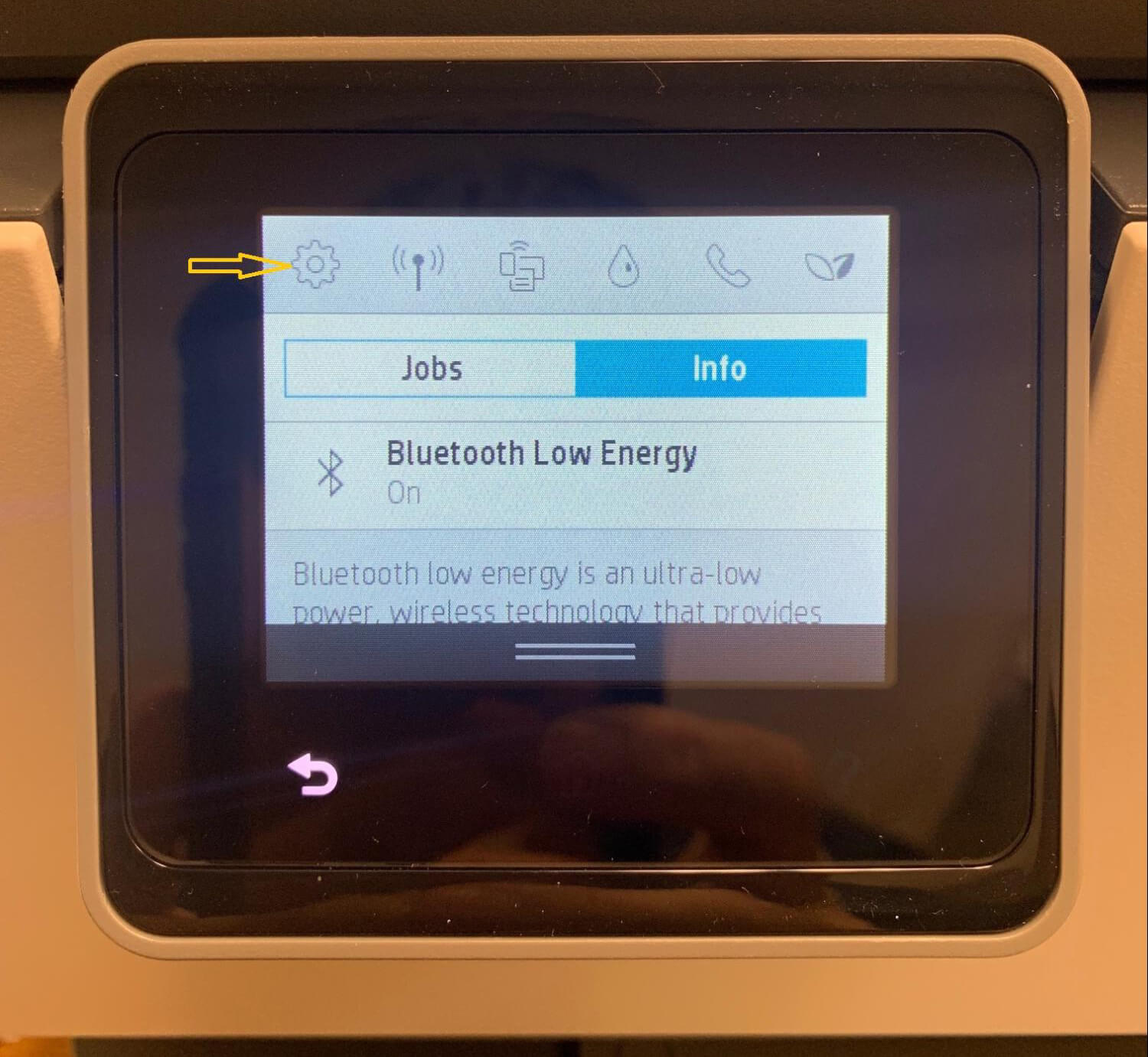 Setup icon on top left printer control panel.