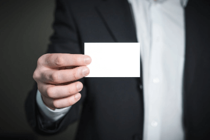A guy in suit holding a paper