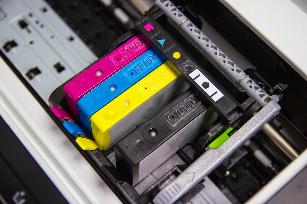 Ink cartridge installed in the correct color slots in a printer.